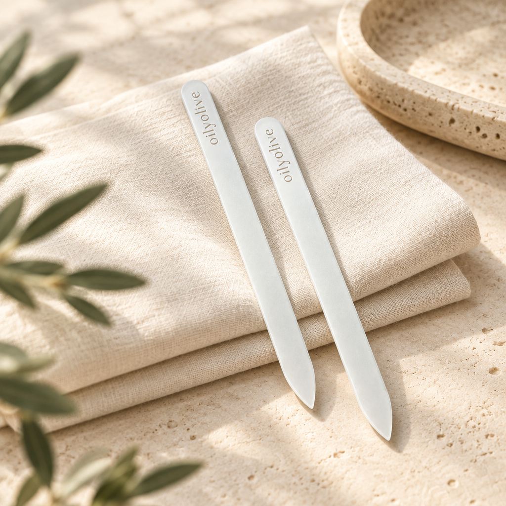 Glass nail files on ivory linen and stone